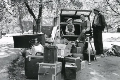 Adams and crew unloading photographic equipment from vehicle, Yosemite