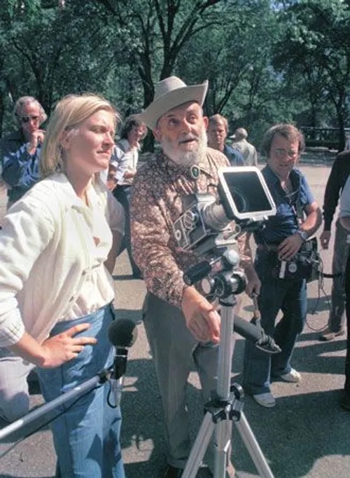 Ansel Adams with Susan Ford, daughter of President Gerald Ford, Yosemite Falls behind them, large format camera between them
