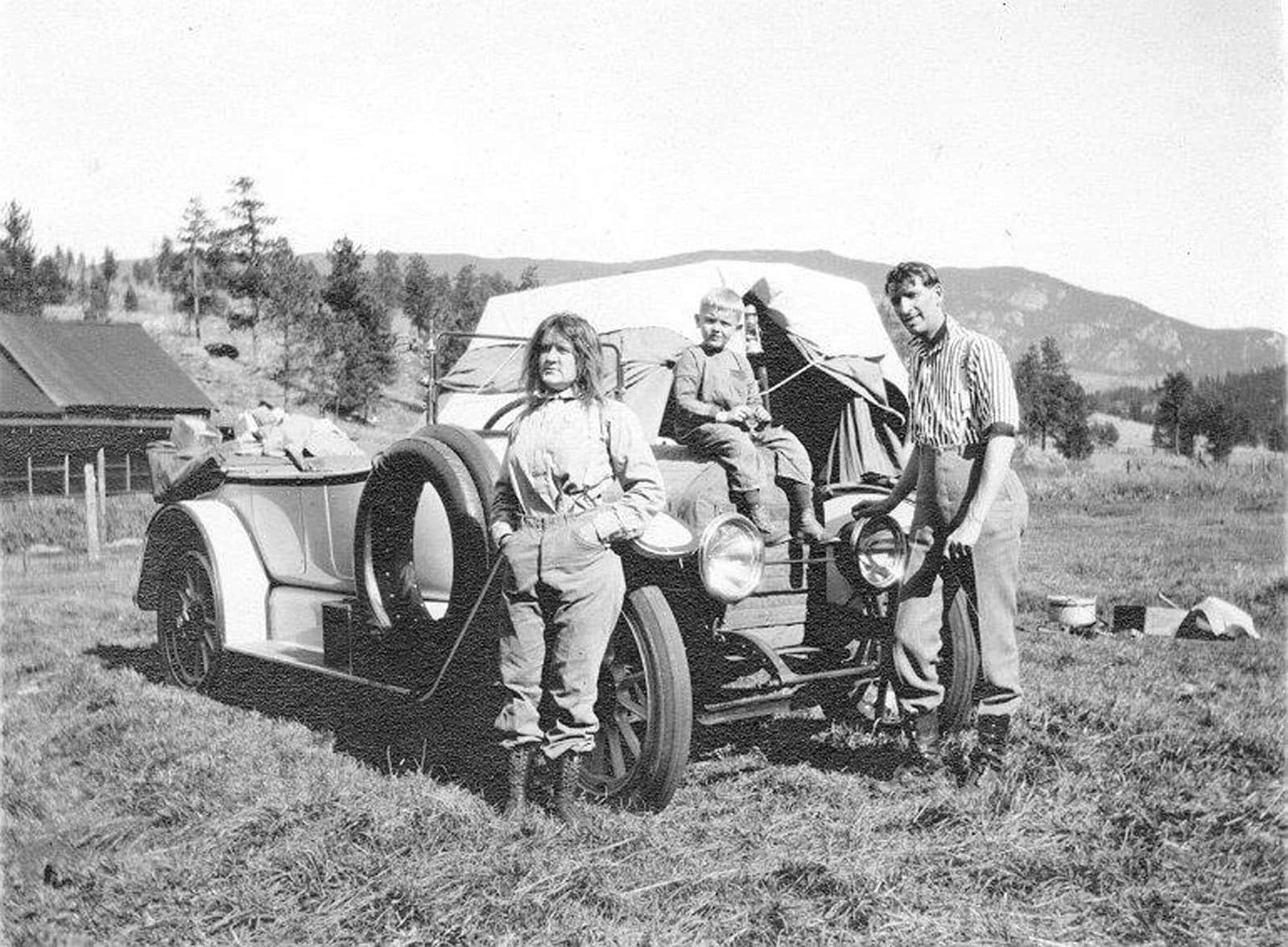 Family camping from automobile, circa 1915